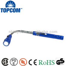 Flashlight with telescopic magnetic pick-up tool